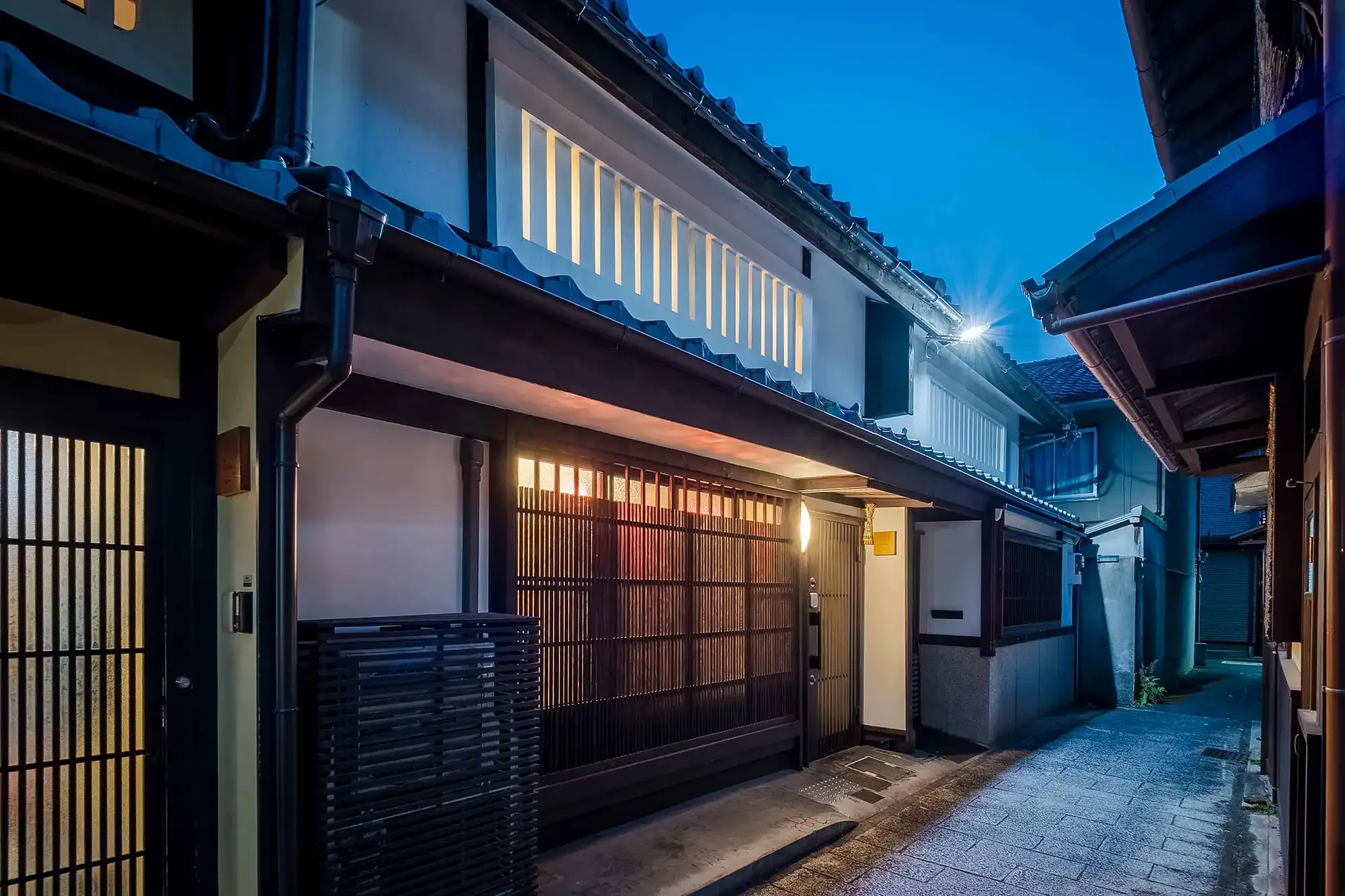 'Akane-an' — the townhouse's street-facing entrance at dusk